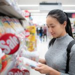 bigstock-Asian-Woman-Is-Choosing-Produc-412349764