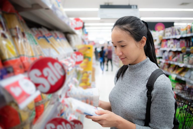 bigstock-Asian-Woman-Is-Choosing-Produc-412349764
